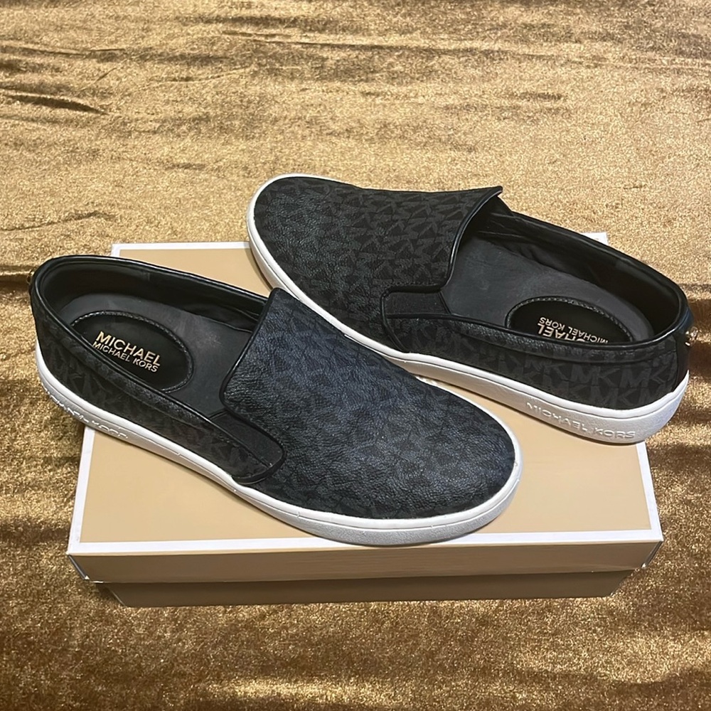 Michael Kors, black leather slip on shoe. Size 7.